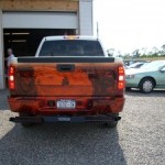 A hidden wheel lift installed under a pickup truck