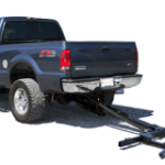 A Lift and Tow wheel lift installed on a Ford pickup truck
